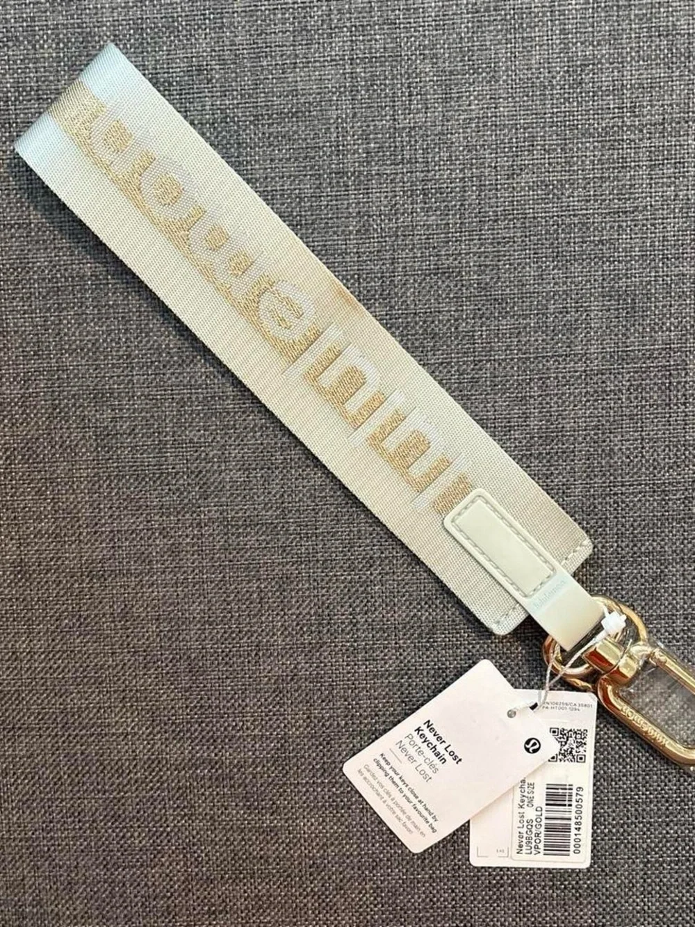 Lululemon Grey & Gold Never Lost Keychain